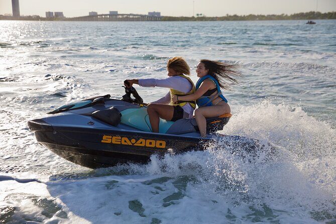 3 Hour Party Boat Jet ski Banana Tube and open bar in Miami - The Setup: Catamaran Party Cruise Meets Jet Ski Time